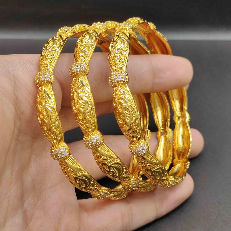 Product Introduction of Hot Selling Wholesale Luxury Fine Engagement Jewelry Embossed Design Bracelet Women Hollow 18k Gold Cuff Bangle For Women Family 12