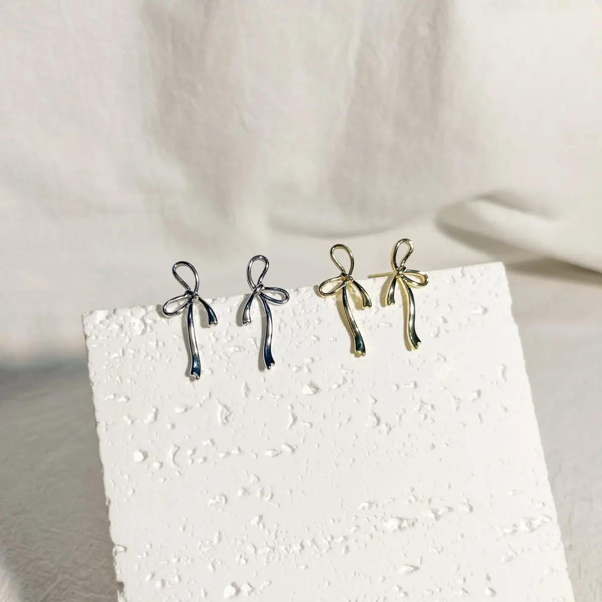 Rebecca Ribbon Stud Earrings Plated