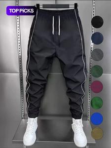 Pantalones jogger casuales y elegantes para hombre con franjas laterales, cintura con cordón y puños elásticos, ideales para ejercicio y uso diario