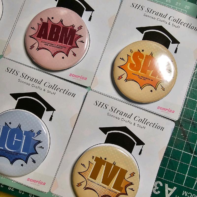 Customized SHS Strands Button Pins with packing - TikTok Shop Philippines