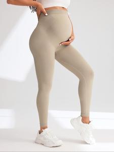 Pantalones de yoga para embarazadas de color sólido, sexy y con moda; ropa interior de embarazo sin costuras con cintura alta, realce de glúteos y soporte abdominal; pantalones deportivos ajustados multicolor para mujeres.