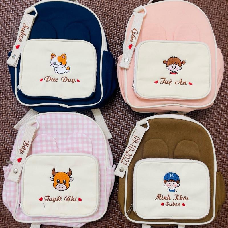 THÊU TÊN Balo Tai Thỏ Thêu Tên Theo Yêu Cầu Dành Cho Bé Trai Bé Gái Phong Cách Hàn Quốc Kích Thước 29x24x10cm 32x28x14cm Chất Liệu Vải Canvas Cao Cấp Tặng Kèm Thẻ Tag Thêu