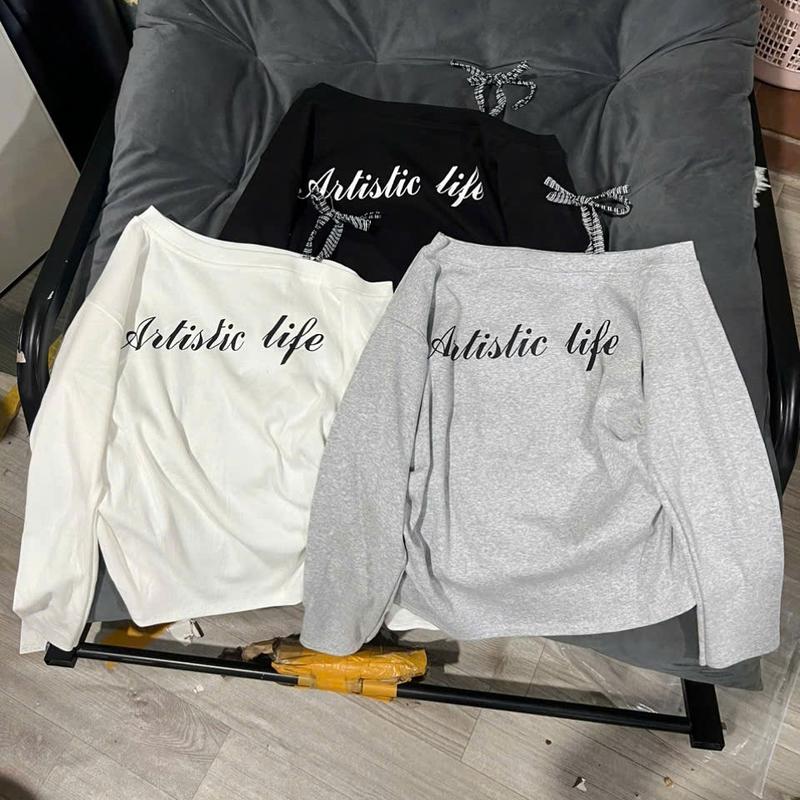   DEAL MỞ BÁN GIẢM 58% Áo thun tăm coton dày dặn lệch vai in chữ buộc nơ vai kẻ nhún eo  mẫu mới 2025 