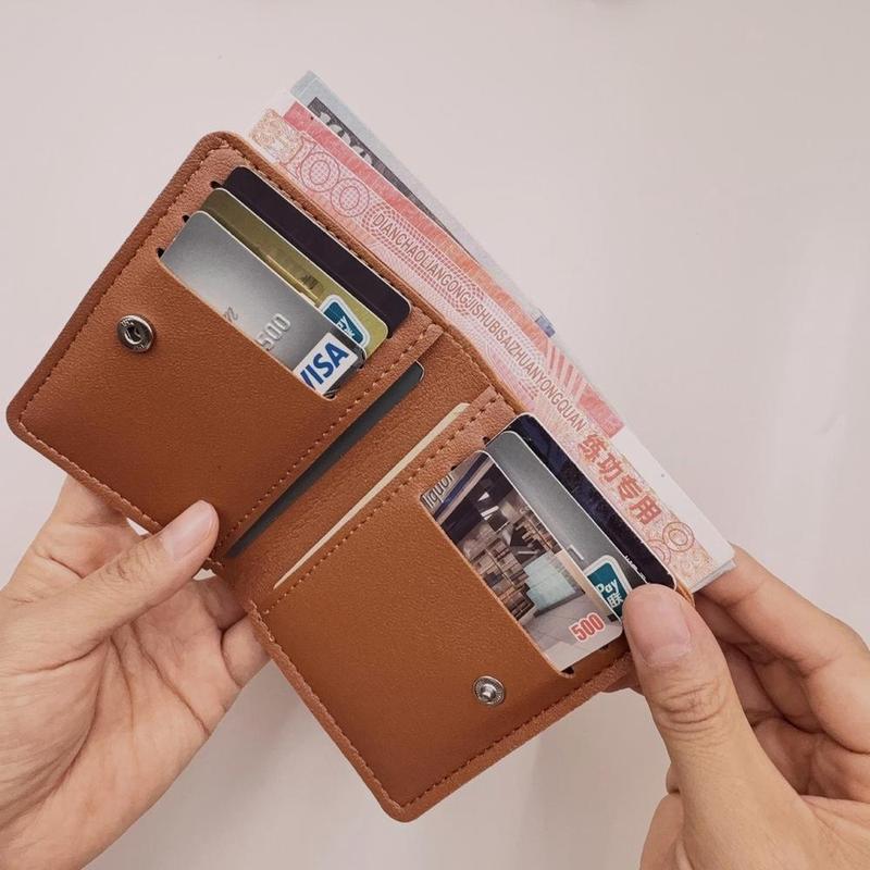 Ví nữ PU mỏng màu trơn, dạng gấp đôi nhẹ, dùng để đựng tiền mặt, phù hợp cho việc đi lại hàng ngày và mua sắm