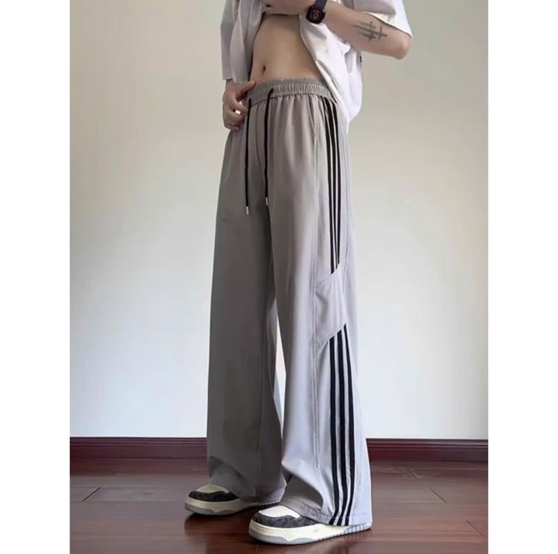 COMBO 2 QUẦN KAKI FOM XUÔNG Nam Nữ Cạp Chun Phối 3 Sọc 2 Bên Ống Rộng Lưng Cao Chất Liệu kaki dày dặn DAGUL