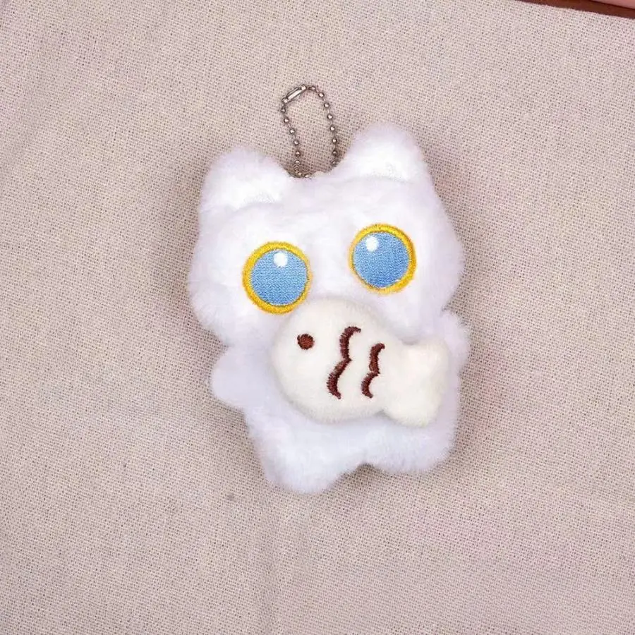Mèo trắng ôm cá