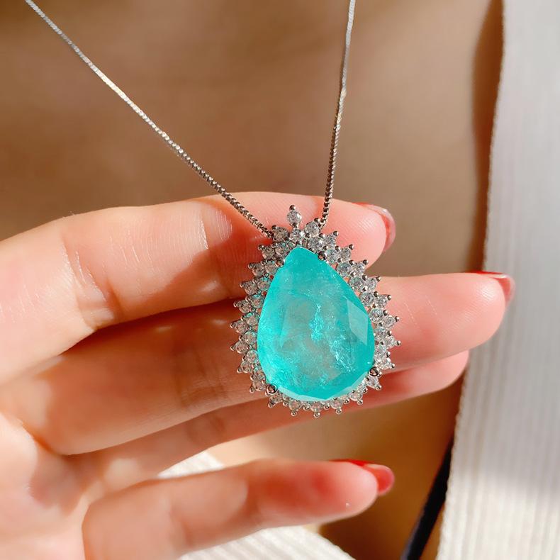 Product Introduction of Micro Inlaid Paraiba Water Drop Gem Necklace Female Ocean Heart Pendant Long Sweater Chain Female 7
