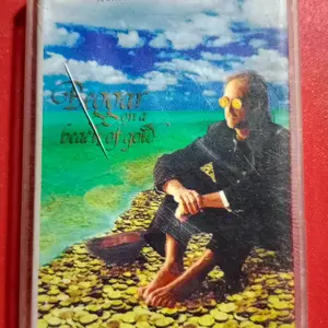 Kaset Beggar On A Beach Of Gold
