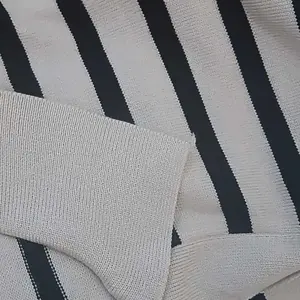 Kaos polo rajut bergaris lengan pendek motif aprikot