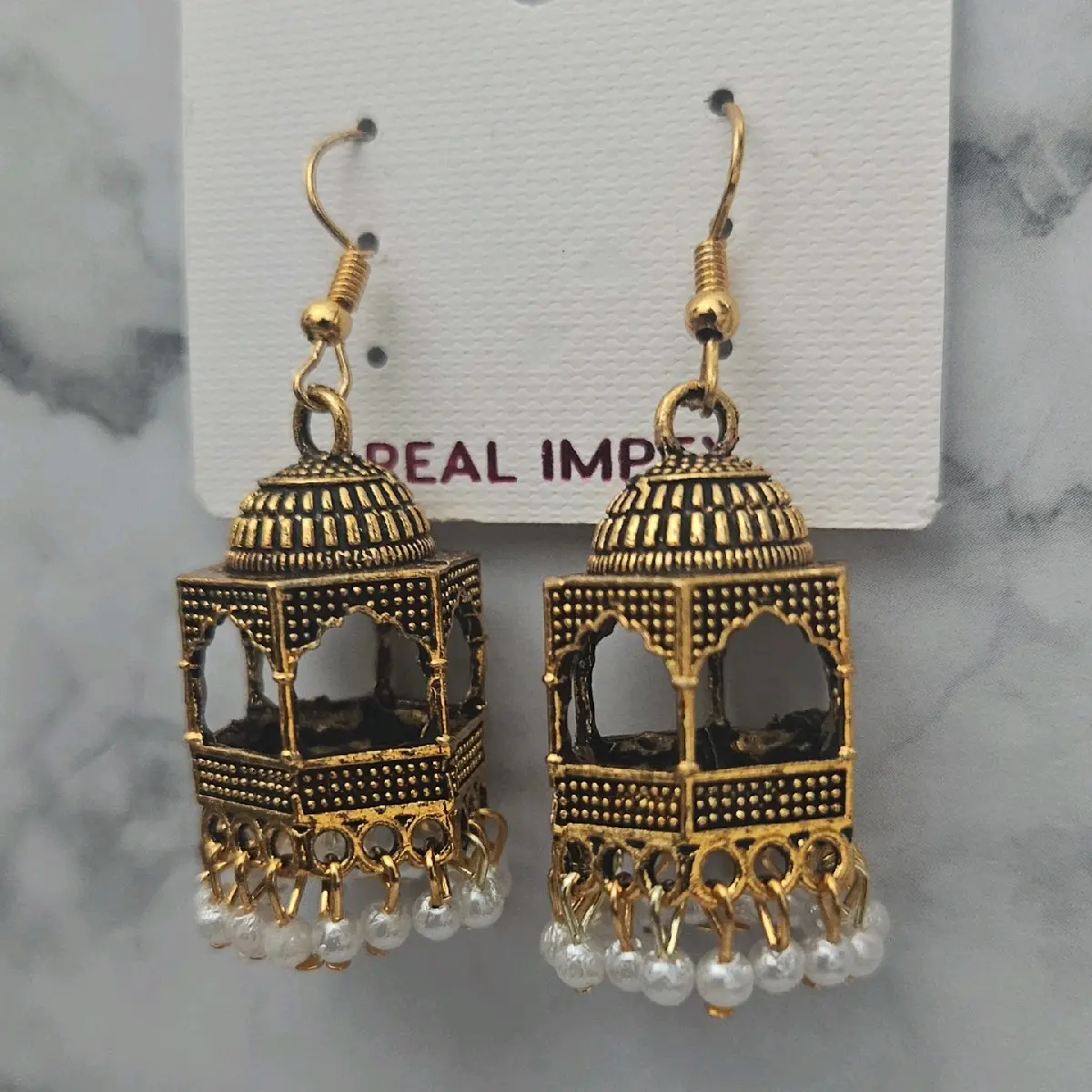 Cage dangle earrings oxidised gold