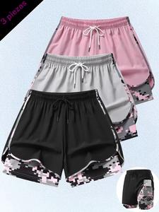 Shorts de gimnasio para mujer con diseño falso de dos piezas, forro camuflado antiexposición de doble capa, bolsillo para teléfono, transpirables y de secado rápido, ideales para fitness y correr.