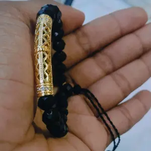 Gelang Kristal Xuping dengan Desain Elegan dan Kombinasi Warna Hitam dan gold untuk Tampilan Mewah
