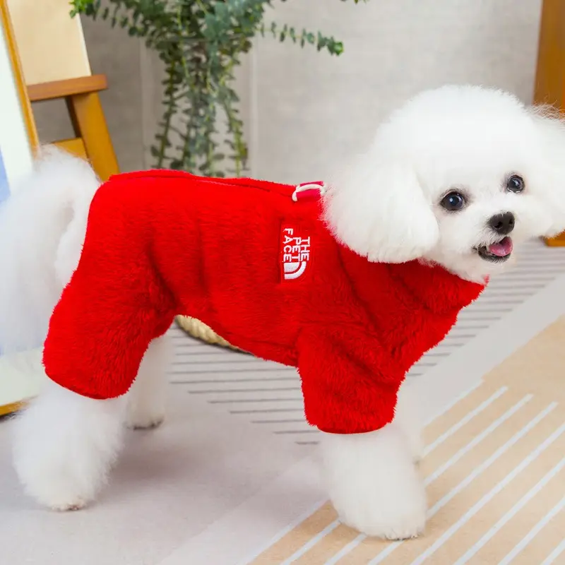 Adorable small dog clothes for spring, featuring a festive red color with a zipper on the back. Made of coral fleece, this onesie-style dog outfit is machine washable and makes a wonderful gift for your friend's dog to kick off the new year.