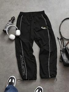 Pantalones largos deportivos casuales para hombre, corte holgado con puño elástico, estampado a la moda, tela ligera, perfectos para uso diario