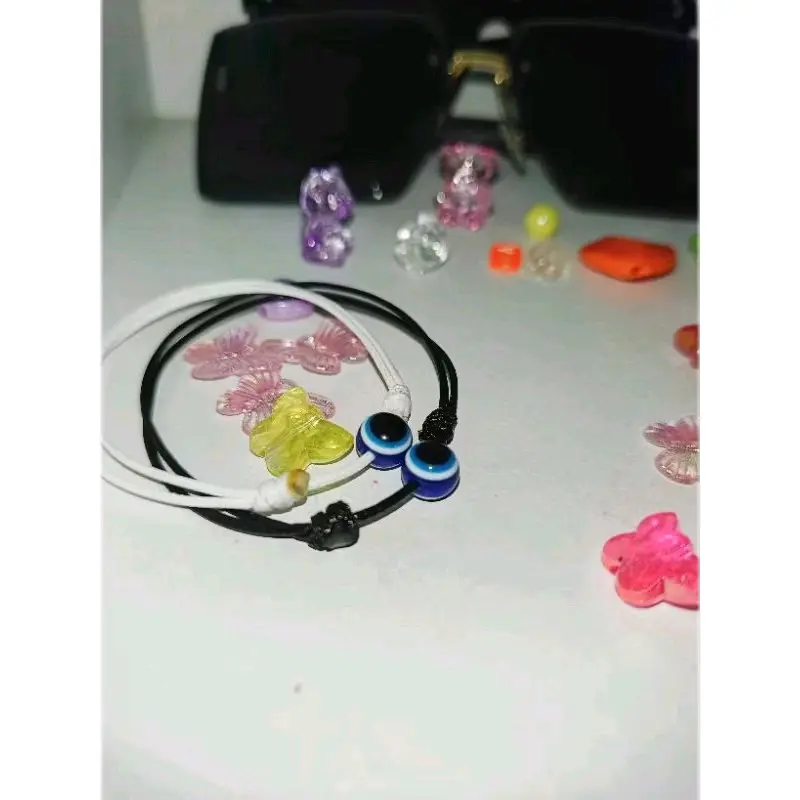 Gelang Hitam Polos Bandul Mata - Bracelets
