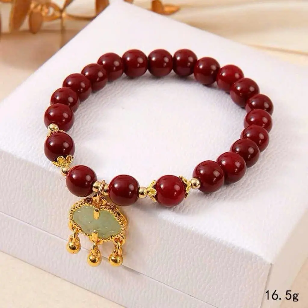 Vòng tay hạt màu đỏ kèm charm trường mệnh