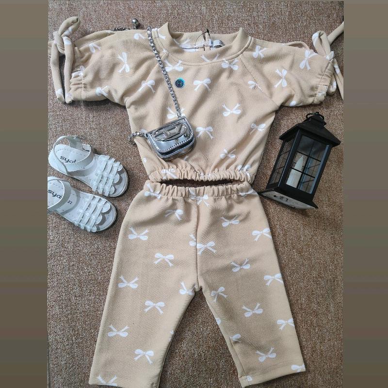 Lovitta oneset knit 6bln - 8th modis dan lucu dengan motif pita-pita Fashion 2