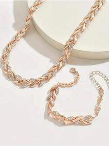 二色の小麦の穂モチーフをあしらったジュエリーセット、シルバーとローズゴールドのクリスタルアクセント付き。 これらのアイテムは2色で提供されており、さまざまなコーデに合わせることができます。 葉の自然でダイナミックなデザインが、シームレスに調和しています。