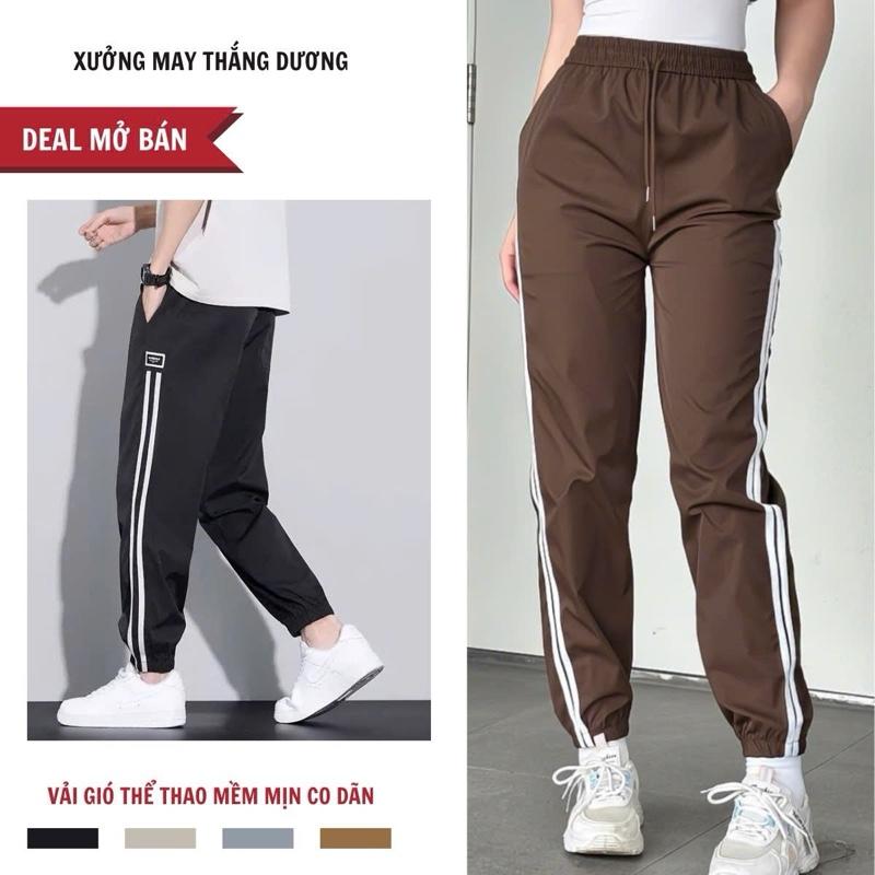 -DEAL Mở Bán- Quần Jogger Nam Nữ 2 sọc Chất Liệu Vải Gió Con Dãn Form Dáng Thể Thao Trẻ Chung Năng Động