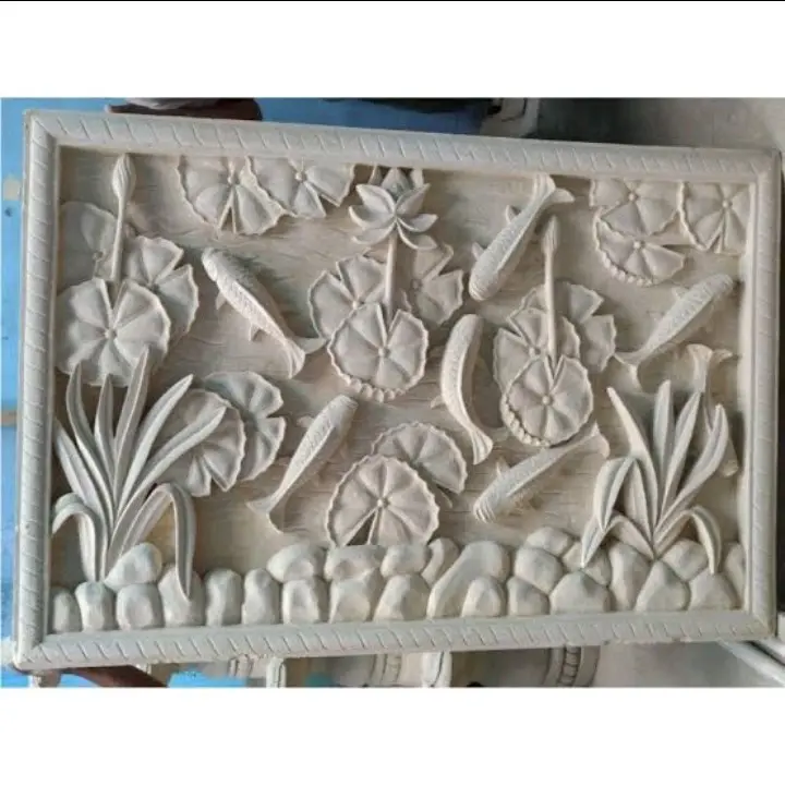 Relief ikan koi dan burung