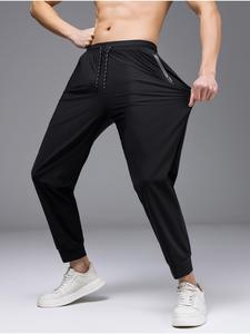 メンズ アイスシルク素材の薄手ロングパンツ、ウエストドローコード付き・ジップポケット付き、無地のジム用バスケットボールウェア、日常の運動用アパレル