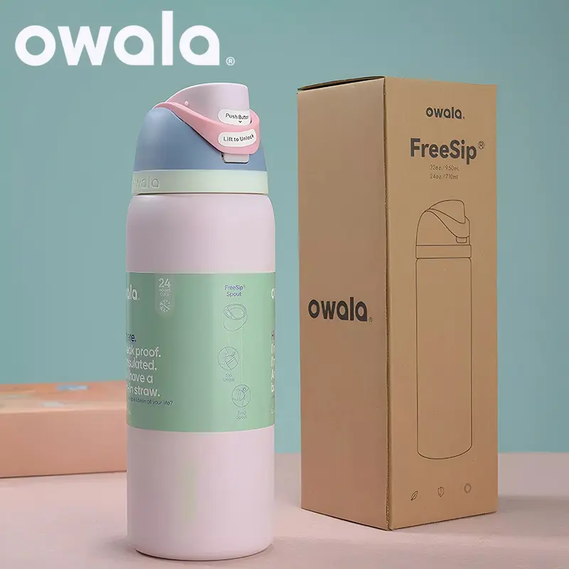 An Owala FreeSip Insulated Stainless Steel Water Bottle 32oz in a two-tone color, with its unique spout visible.