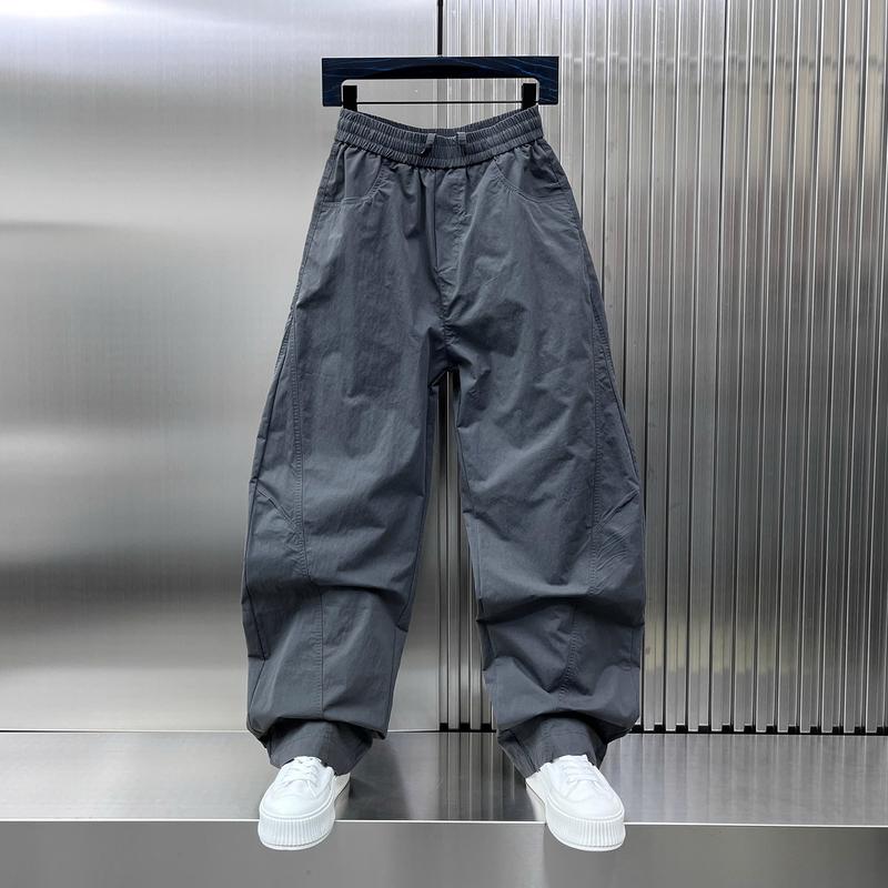 Quần Gió Unisex Nam Nữ Mặc Được Form Ống Rộng Mặc Thoải Mái Cạp Chun Co Giãn Dễ Dàng Hoạt Động Chất Gió Chống Nước Chống Gió - QG225