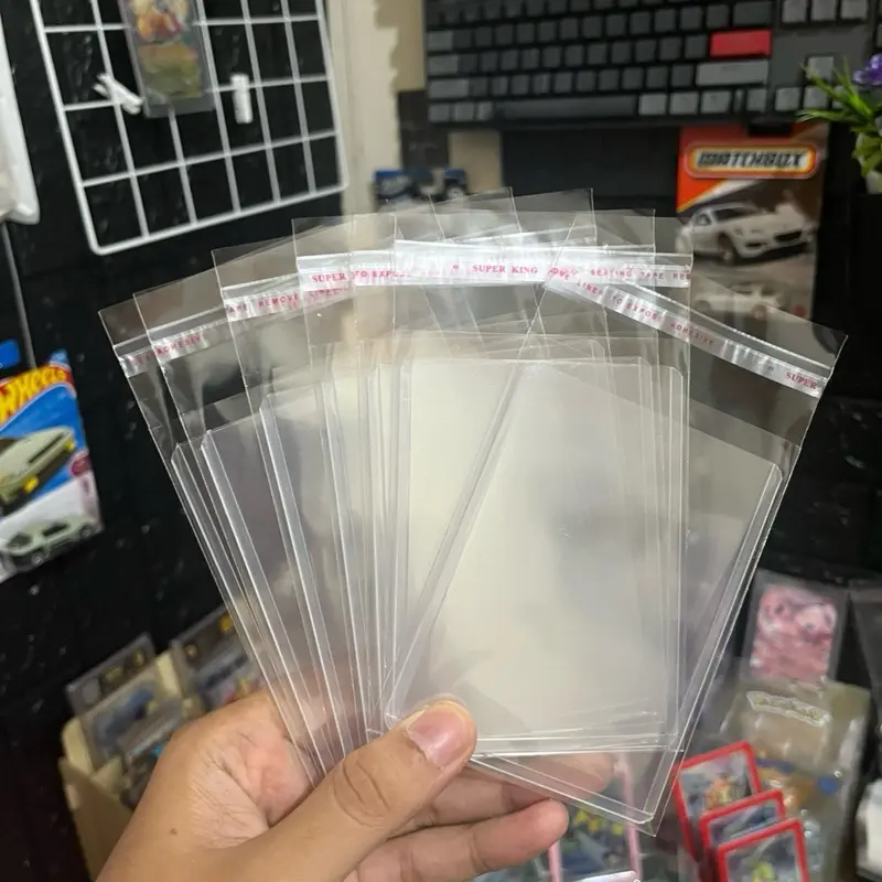 Toploader TCG Grade A Premium Bonus Outersleeve dan Kartu Collectibles Random isi 7 untuk Penggemar Kartu Koleksi