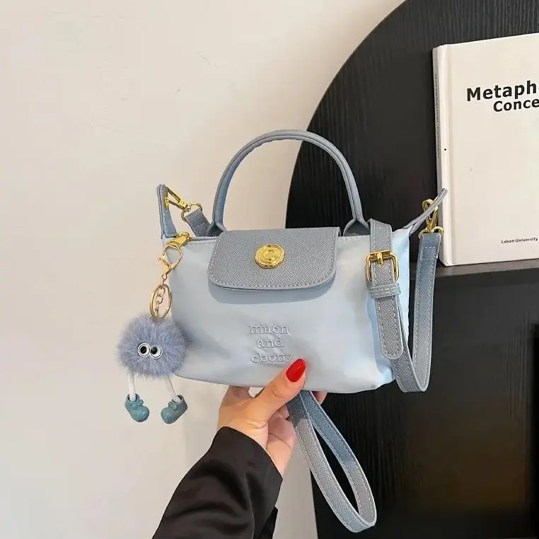 2024 New trendy niche portable saddle bag versatile ins diagonal makeup bag fashionable light luxury crossbody bag 2