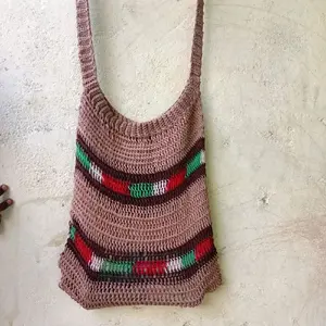 noken jaring rajut papua melar bahan benan nilon.