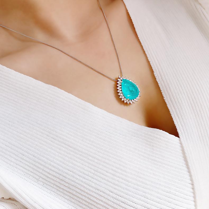 Product Introduction of Micro Inlaid Paraiba Water Drop Gem Necklace Female Ocean Heart Pendant Long Sweater Chain Female 9