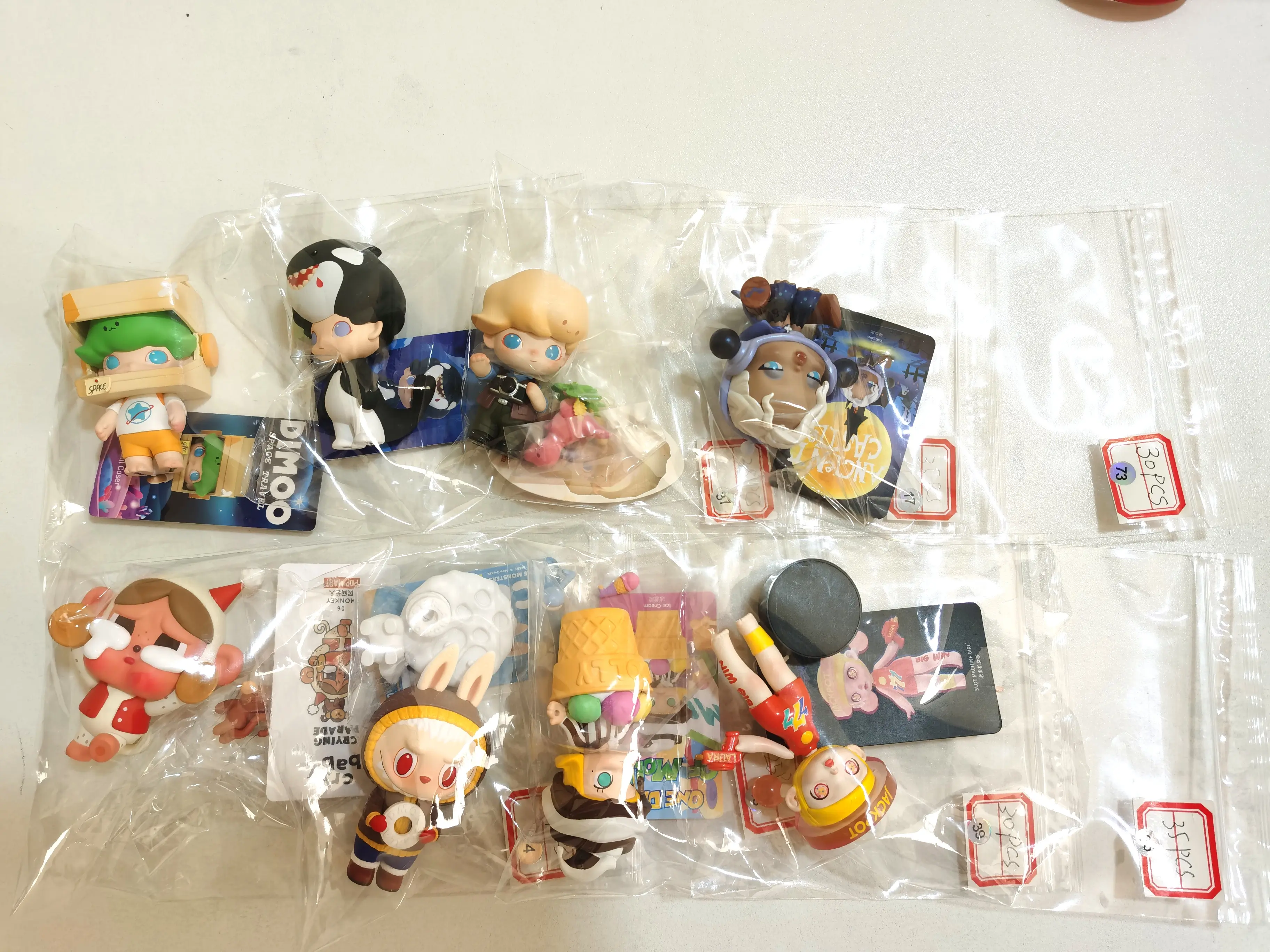 Open and confirmed boxes with dolls