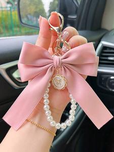 Adorno para bolso de mujer con diseño elegante de lazo, llavero lindo y moderno para bolso, decoración de moda para el bolso diario y adorno para llaves del coche.