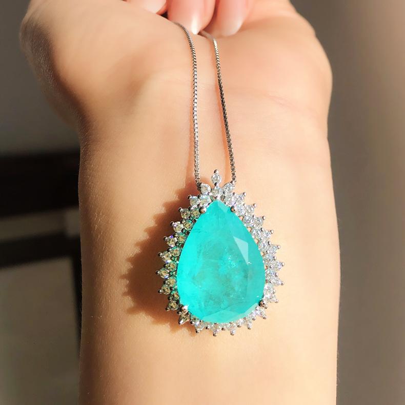 Product Introduction of Micro Inlaid Paraiba Water Drop Gem Necklace Female Ocean Heart Pendant Long Sweater Chain Female 12