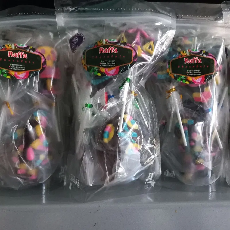 Kemasan box isi 25pcs coklat karakter permen paku 4