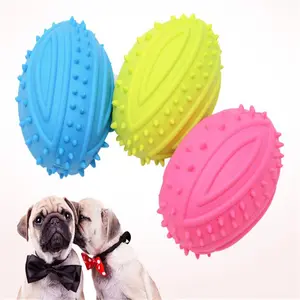 mainan gigitan bola oval bunyi untuk melatih gigi anjing